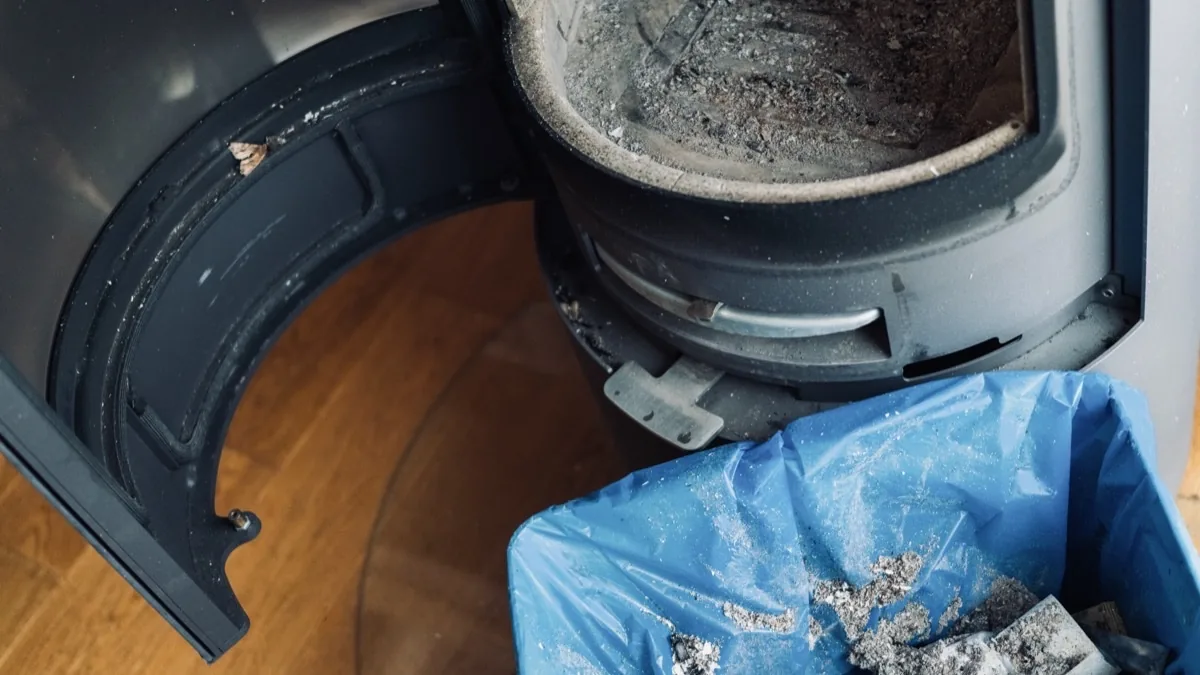 Technician performing fireplace and stove service